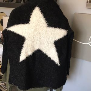 Black sweater w white star. Very good condition